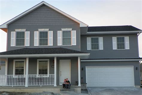 dark grey house with white shutters